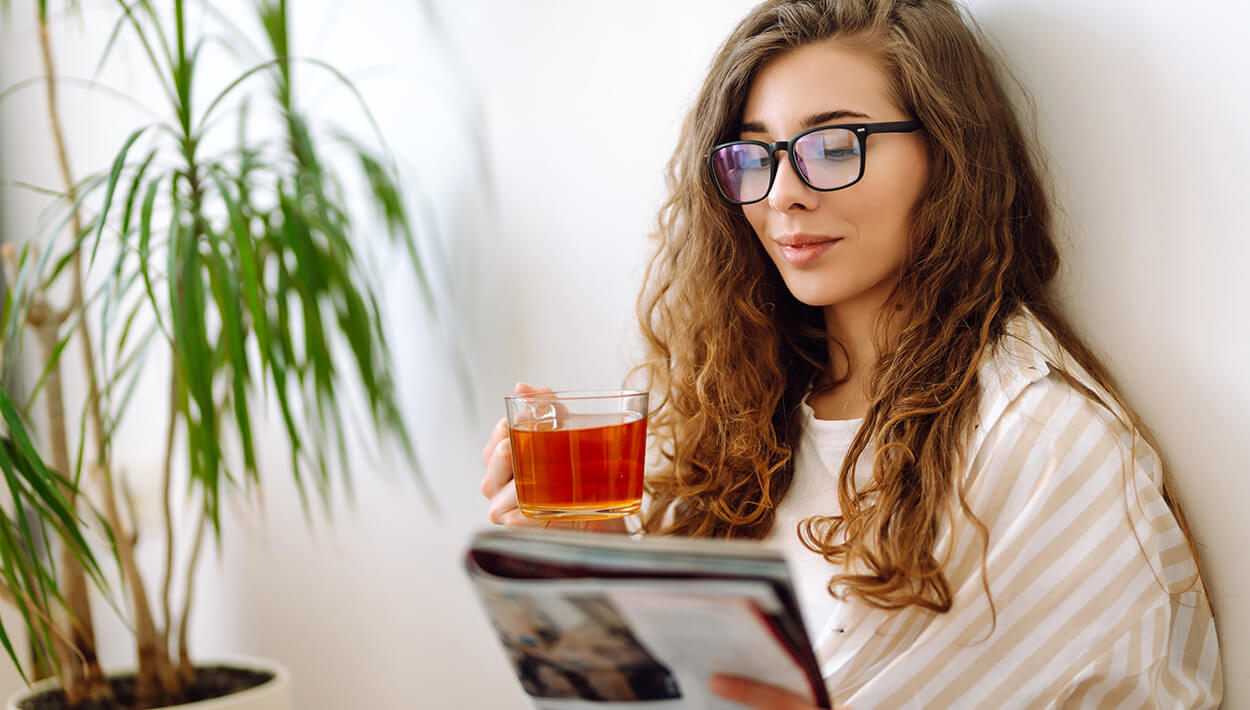 woman reading a magazine